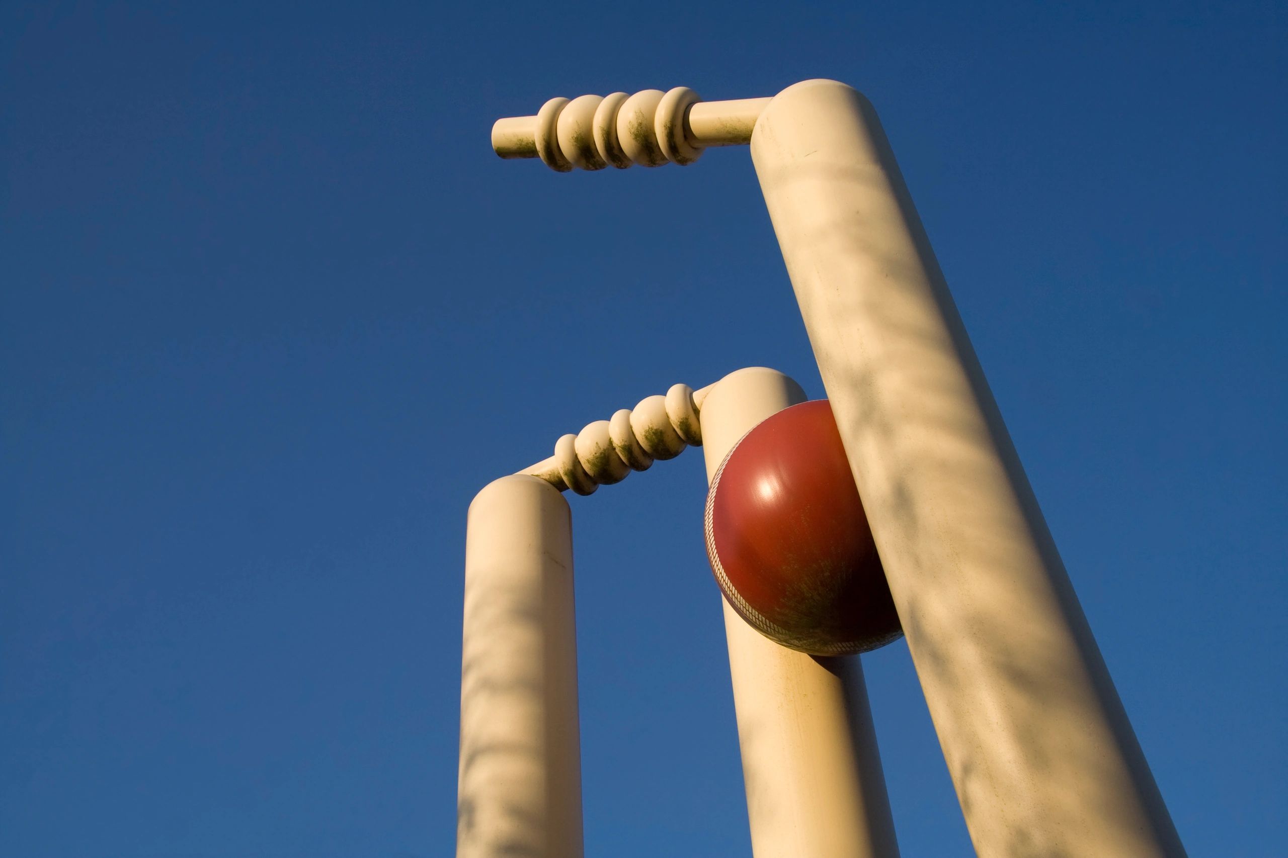 Cricket stumps shattered by the new ball